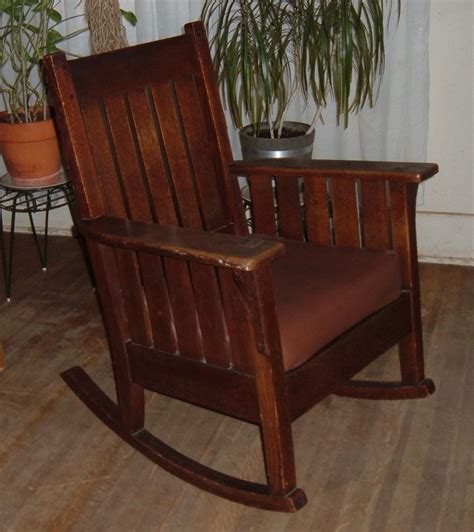 The rich wood finish is beautiful accompaniment to the neutral, solid upholstery, enhancing rustic aesthetics. Mission Rocking Chair | Collectors Weekly
