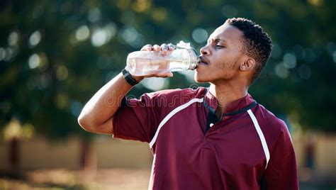 Rugby Sports Or Black Man Drinking Water In Training Exercise Or