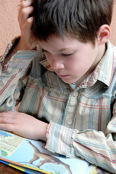 Boy Reading Photograph By Aj Photoscience Photo Library Pixels