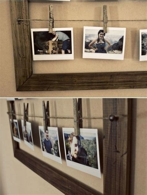 Two Pictures Hanging On A Wall With Clothes Pins Attached To Them And