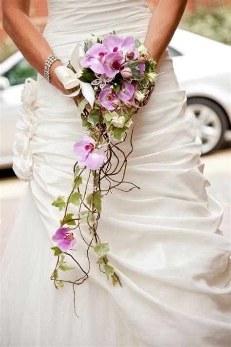 The bride's bouquet featured baby's breath sprayed with gold next to bright white peonies and ranunculus blossoms for her new year's eve ceremony. A unique modern bridal shower bouquet an original creation ...