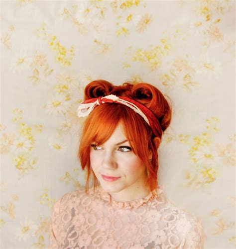 Two thick strands are taken from the front and rolled into large rolls. How To Style Victory Rolls - A Beautiful Mess