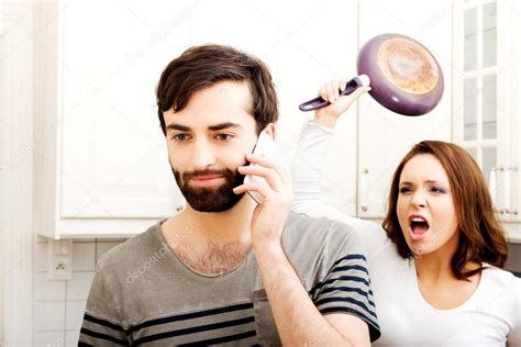 Angry Young Woman Hitting Men With Frying Pan — Stock Photo © Piotr