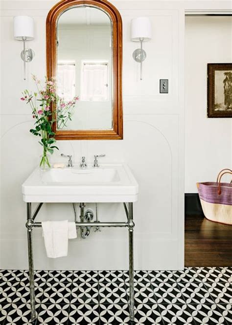 Brushed gold aluminium frame enhances its circular shape. Statement Mirrors For The Bathroom - Emily A. Clark