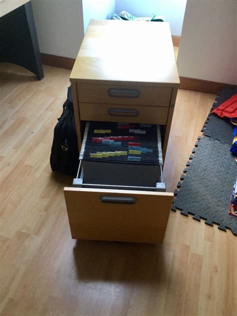 She wanted a queen size bed, so that limited our square footage for the office. Ikea under desk filing cabinet, 2 draws and is on castors ...