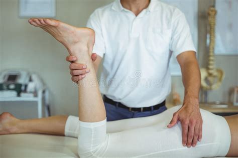 Physiotherapist Giving Leg Massage To A Woman Stock Image Image Of