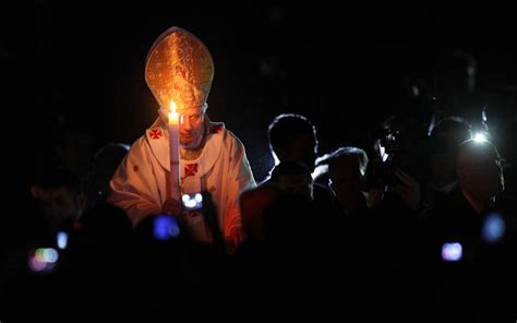 Pope Benedict Xvi Carries The Paschal Candle As He Leads The Ceremony Of The Light During The