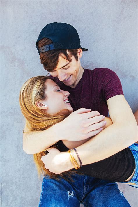 Teenage Couple Hugging Together From Above By Stocksy Contributor