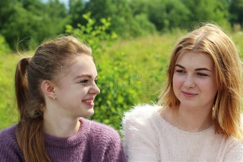 Two Young Girls Having Time Together In Summer Season Stock Image