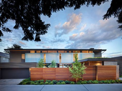 For example, instead of placing the wood boards vertically try thinking horizontally. Courtyard House - Midcentury - Exterior - Seattle - by ...