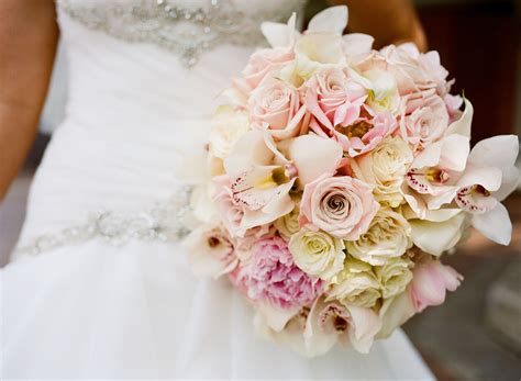 These botanical varieties blend beautifully with a whimsical, bohemian aesthetic. Beautiful wedding bouquet of pink roses, peonies ...