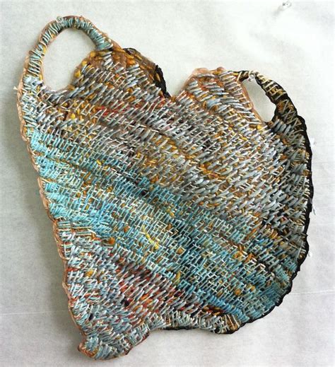 The body of the bag is a long strip of nothing but knit stitch. josh blackwell embroidered plastic bag | Textilkunst ...