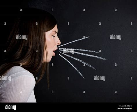 Young Woman Against A Chalkboard Stock Photo Alamy