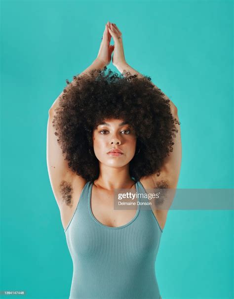 Mixed Race Woman Showing Armpit Hair In The Studio High Res Stock Photo
