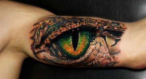 These tattoos look like they are intricate sandals painted on the feet. Highly detailed and photo realistic, this lizard eye ...