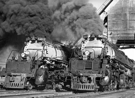 Union Pacific #4012 and #4018 in front of a coaling tower. Both