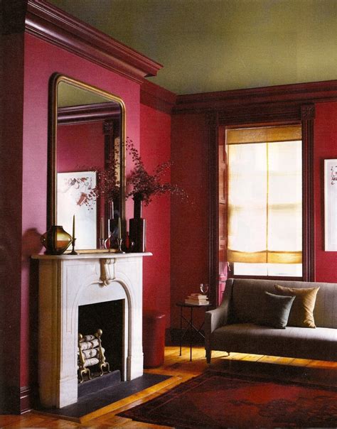 A pop of yellow in a throw pillow and floral arrangement adds a ray of sunshine. awesome colours | Burgundy room, Burgundy living room ...