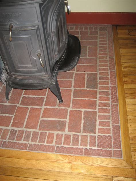 I'm thinking of using 150x150x12.5mm red quarry tiles on the. This wood stove pad was the design of the homeowner. She ...