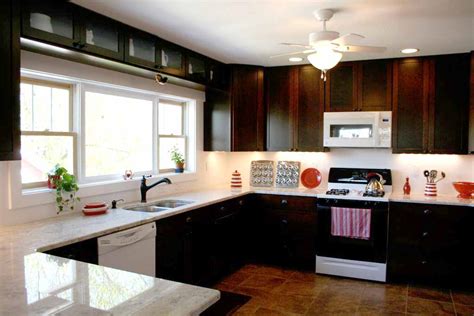 Traditional kitchen design with white cabinetry, carrara marble countertops, marble backsplash, and dark hardwood floors by pacific peninsula group. Umple Corner: The Big Reveal (part I)
