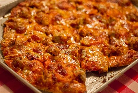 Old style pizza restaurant complete with brown wood paneling, red rug, sports memorabilia on the walls. Monte Bello Pizzeria | Affton/ Concord | American ...