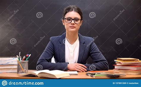 Serious And Strict Female Teacher Looking To Camera Education Reform