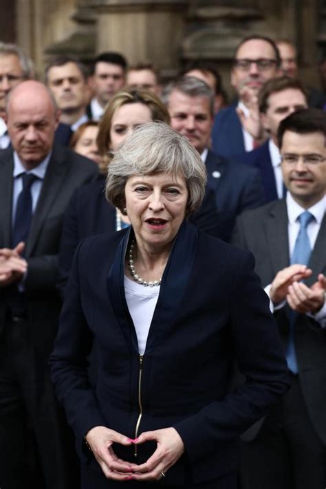 Merkel herself said the gesture arose as a pragmatic solution to the problem of what to do with one's hands in pu. Some conspiracists think Theresa May and Angela Merkel are ...