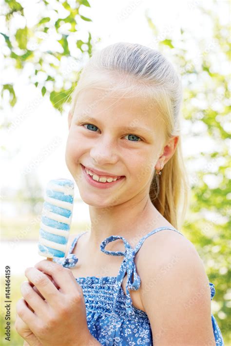 Portrait Of 7 Years Old Kid Little Girl Eating Tasty White Blue Ice