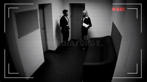 Male And Female Colleagues Talking Office Corridor Cctv Camera Effect