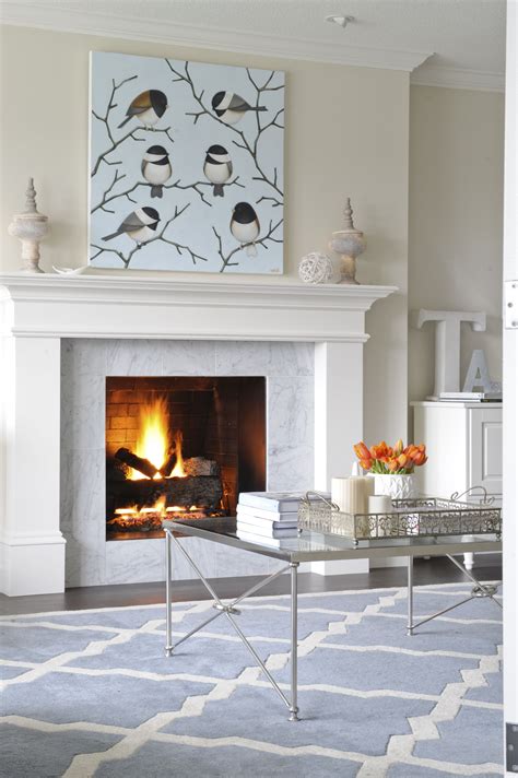 See how these white fireplaces both warm and brighten a room, while a fireplace made of white stone blocks with a light brick firebox adds simple elegance to this cozy, neutral room. Living Room designed by Enviable Designs - This fireplace ...