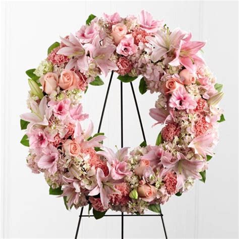 Flowers are the traditional thing, but you also know that flowers wither and die. Peaceful Pink Flower Wreath Spray at Send Flowers