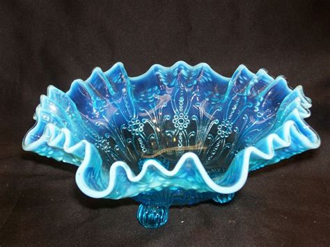 There are many pieces in this pattern, ranging from simple teacups to relish dishes and other rare serving pieces. Northwood Glass Blue Opalescent Ruffled Pearl Flowers ...