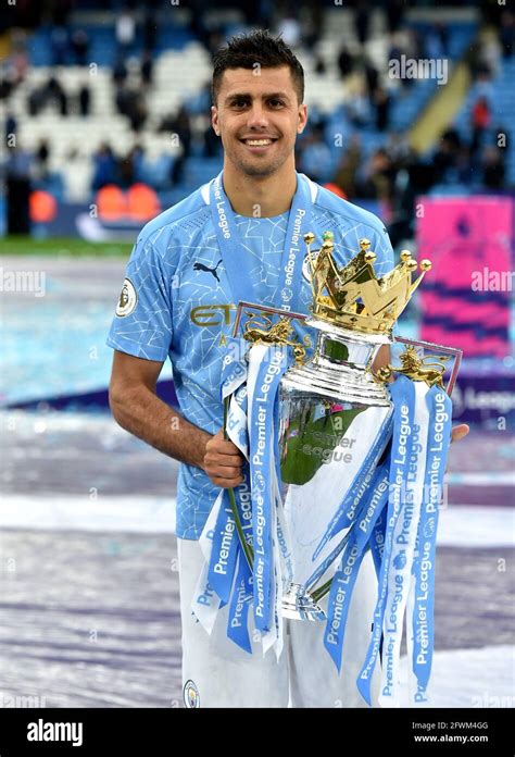 Manchester Citys Rodri Poses With The Trophy After The Premier League