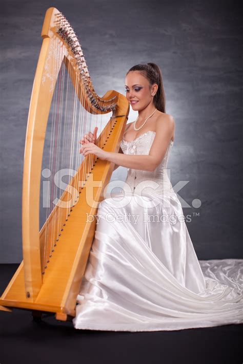Young Woman Playing Harp Stock Photo Royalty Free Freeimages