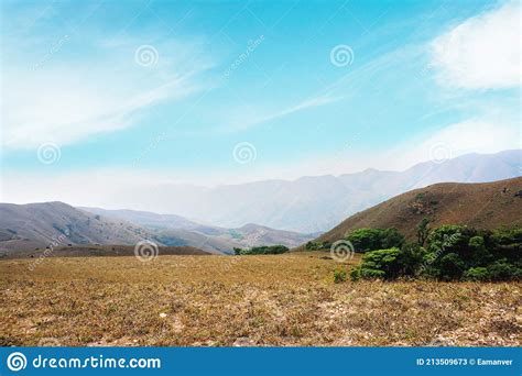 Green Valley And Mountain Range With Moody Sky Stock Image Image Of