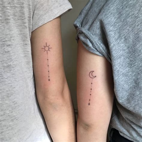 matching-sun-and-crescent-moon-tattoos-on-upper-arms-tattoos-for-daughters,-matching-tattoos