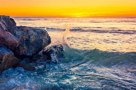 Waves Crashing On The Rocks At Sunset Stock Photo Image Of Summer