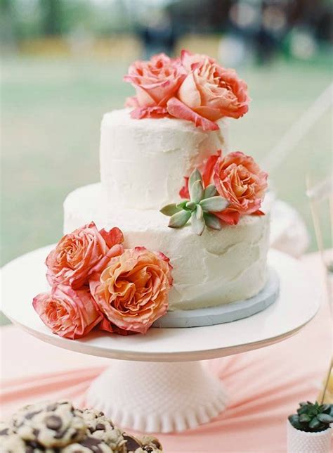 Fill the posy pic with some of the pink sugarpaste and press it centrally into the top tier. Ivory Wedding Cake with Coral Roses & Succulents | Wedding ...