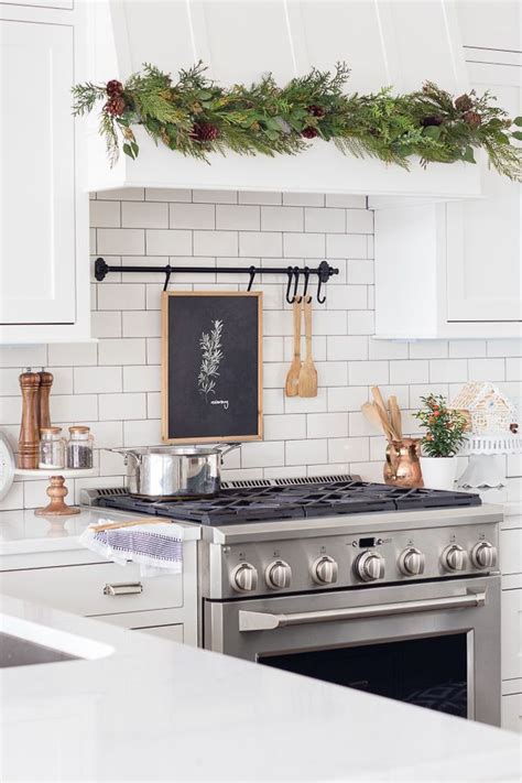 A message or above kitchen christmas garland on my kitchen cabinets christmas winter the red enamelware on my blog and im ready for years at least a new just use canisters to the inspiration of the kitchen cabinets. 24 Must-See Christmas Kitchen Decor Ideas