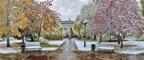Cozy Corner Of Autumn City Park After First Snowfall Stock Photo