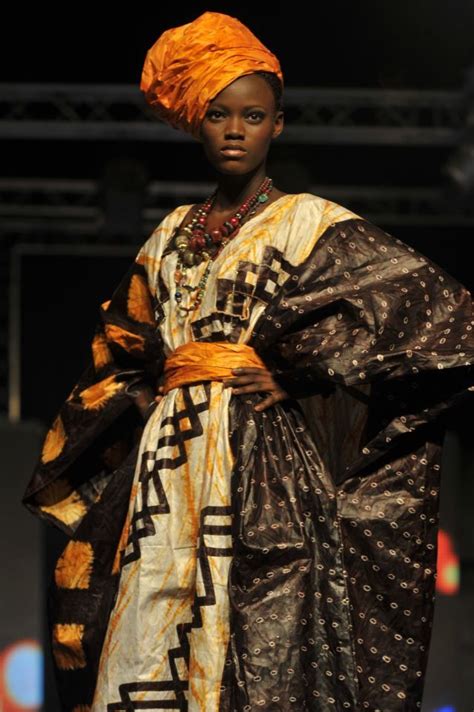 A Model Wears A Creation By Iconic Designer Alphadi Of Niger During