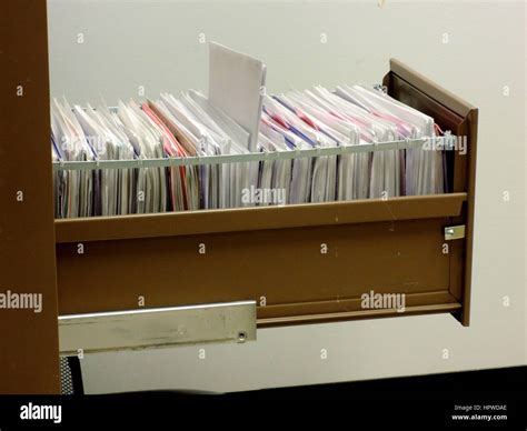 Metal File Cabinet With Hanging File Folders Stock Photo Alamy