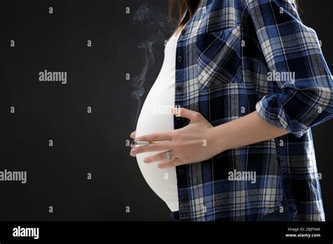 Pregnant Woman Smoking Cigarette On Dark Background Stock Photo Alamy