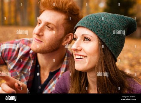 Happy Young Couple In Autumn Forest Stock Photo Alamy