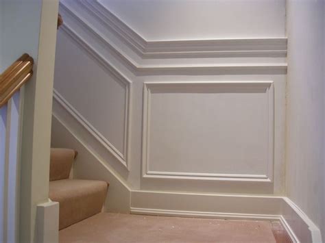 Chair rails are a great decorative feature that also protect walls. Chair rail with banding and applique squares | Wainscoting ...