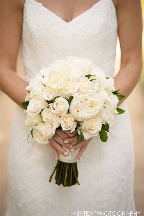 Your overall wedding budget will have an impact on the type of bouquet you can afford. Bridal bouquet - all white rose bouquet - wedding gown ...