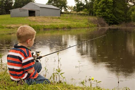 Little Boy Fishing In Pond Stock Photo Image Of Fishing 61645058