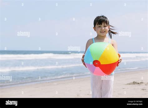 Young Girl With Ball On The Beach Stock Photo Alamy