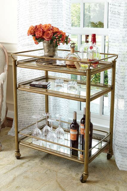 The cart features 2 handles, functioning wheels, a top mirrored shelf with wine glass holders, and a bottom mirrored shelf with 3 wine bottle holders. The Most Favorited Bar Cart Design Concept for You - HomesFeed