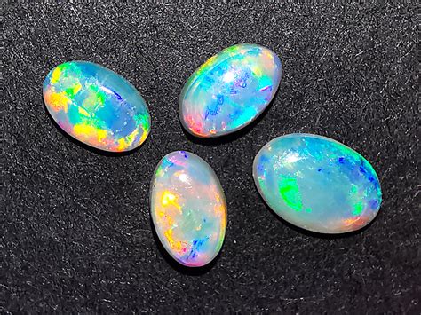 A mineral of hydrated silica. Coober Pedy Australia - Set of Four Solid Crystal Opals ...
