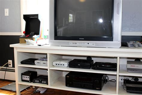 The montrose console table with shelf features a powdercoated steel base with a minimal honed travertine stone top. Racketboy's Game Room & Home Office - RetroGaming with ...